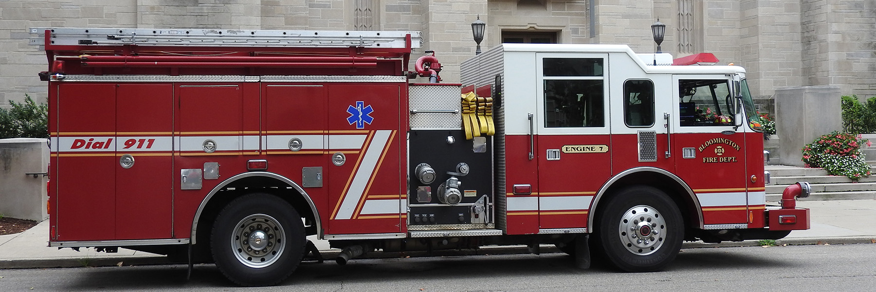Bloomington Fire Department truck parked in front of a campus building.