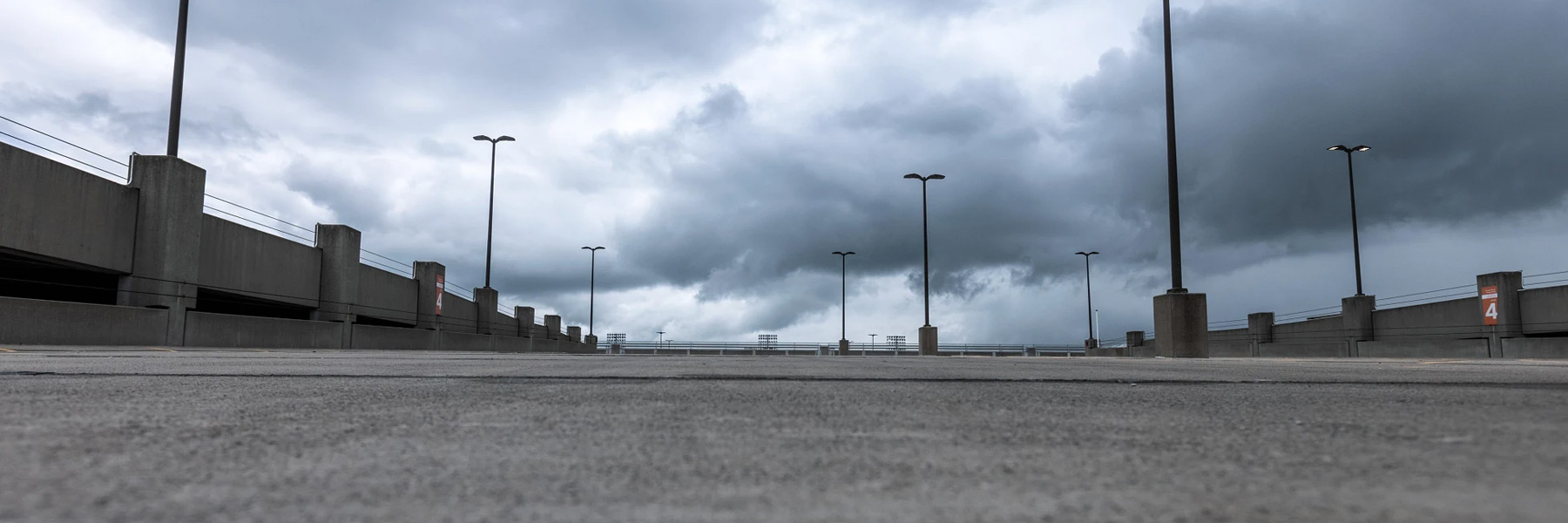 A rooftop view of an empty IUPUI campus garage as a storm rolls in.