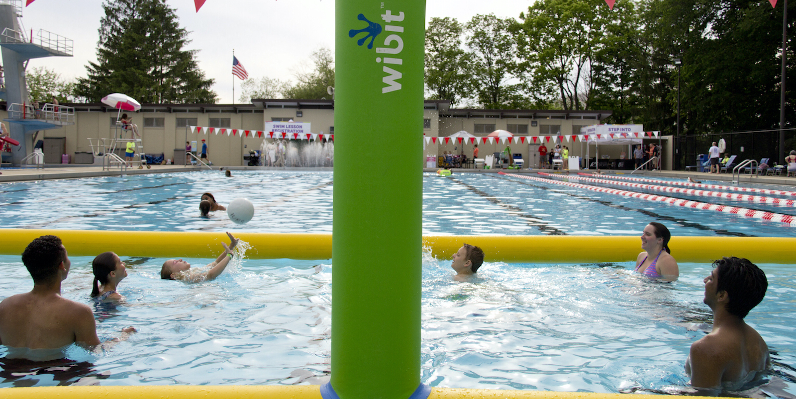 People playing water volleyball in a swimming pool